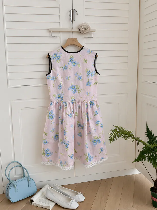 Pink floral dress on a hanger
